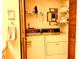 Open laundry room with washer and dryer on tile floor and storage shelves at 4558 Blossom Blvd # D, Zephyrhills, FL 33542