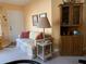 Cozy living room featuring a floral sofa, charming lamp, and a classic wooden hutch at 4558 Blossom Blvd # D, Zephyrhills, FL 33542