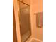 Bathroom shower with framed, glass doors and a decorative towel on the towel rack at 4558 Blossom Blvd # D, Zephyrhills, FL 33542