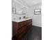 Bathroom features a double vanity, modern fixtures, and hexagon tile flooring at 4715 Kemble Ct, Tampa, FL 33624