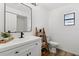 Bathroom featuring modern sink, toilet, ladder shelf, and ample natural light at 4715 Kemble Ct, Tampa, FL 33624