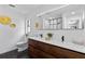 Modern bathroom with double vanity, hexagon tile floor, and walk-in shower at 4715 Kemble Ct, Tampa, FL 33624