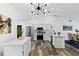 Modern kitchen featuring white cabinets, stainless steel appliances, and stylish countertops at 4715 Kemble Ct, Tampa, FL 33624