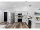 Bright kitchen with stainless steel appliances, white cabinets, and modern fixtures at 4715 Kemble Ct, Tampa, FL 33624