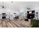 Open living space featuring modern decor, a fireplace, and seamless flow to the kitchen and dining areas at 4715 Kemble Ct, Tampa, FL 33624