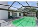 Relaxing screened-in pool area with a patio and easy access to the home through sliding glass doors at 4715 Kemble Ct, Tampa, FL 33624