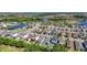 Expansive aerial view capturing a community with serene lakes, lush greenery, and well-spaced homes at 5415 Los Robles Ct, Palmetto, FL 34221