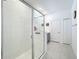 Elegant bathroom with a glass shower and a tile floor leading to a sink at 5415 Los Robles Ct, Palmetto, FL 34221