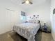 Cozy bedroom with a queen-size bed, closet and a nightstand, offering a comfortable and stylish retreat at 5415 Los Robles Ct, Palmetto, FL 34221