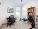 Bright bedroom features a ceiling fan, a large window and a dedicated workspace at 5415 Los Robles Ct, Palmetto, FL 34221