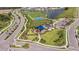 Aerial shot featuring a community park with a playground, basketball court, and splashpad next to a lake at 5415 Los Robles Ct, Palmetto, FL 34221