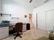 Functional home office featuring ample desk space, neutral walls, and carpeted floors for added comfort at 5415 Los Robles Ct, Palmetto, FL 34221