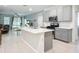 Modern kitchen features stainless steel appliances, white countertops and an island at 5415 Los Robles Ct, Palmetto, FL 34221