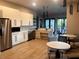 Contemporary kitchen with stainless steel appliances, sleek cabinetry, and a functional island for food preparation at 5415 Los Robles Ct, Palmetto, FL 34221
