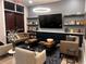Contemporary lounge with comfortable seating, modern lighting, and stylish decor for relaxation and socializing at 5415 Los Robles Ct, Palmetto, FL 34221