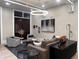 Modern lounge area with elegant furnishings, chic lighting, and a cozy ambiance perfect for relaxation at 5415 Los Robles Ct, Palmetto, FL 34221