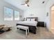 The main bedroom features two large windows, a ceiling fan, and a sitting area for relaxing at 5415 Los Robles Ct, Palmetto, FL 34221