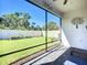Covered, screened in porch features pavers and unobstructed views of the private yard at 5415 Los Robles Ct, Palmetto, FL 34221