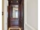 A luxurious home elevator featuring rich wood paneling and a mirrored back, adding convenience and elegance to the residence at 5630 Bayview Dr, Seminole, FL 33772
