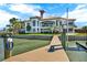 Beautiful view of the luxury house from the private boat dock on the water at 5630 Bayview Dr, Seminole, FL 33772