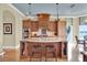Spacious kitchen with custom wood cabinetry, granite island, and modern appliances, perfect for entertaining at 5630 Bayview Dr, Seminole, FL 33772