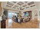 Expansive living room with water views, coffered ceilings, and elegant furnishings at 5630 Bayview Dr, Seminole, FL 33772