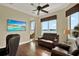 Comfortable living room with hardwood floors and ocean view is sure to please at 5630 Bayview Dr, Seminole, FL 33772