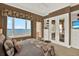 Beautiful main bedroom with stunning water views, ensuite bath, and walk-in closet at 5630 Bayview Dr, Seminole, FL 33772