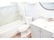 Modern bathroom with tile surround, updated fixtures, and plenty of storage at 7435 Hollyridge Dr, New Port Richey, FL 34653