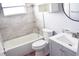 Beautifully renovated bathroom featuring a shower-tub combination and a contemporary vanity at 7435 Hollyridge Dr, New Port Richey, FL 34653