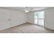 Bright bedroom with carpet, a ceiling fan, and natural light from a window at 7824 Blackstone Dr, Port Richey, FL 34668