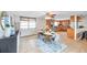 Open concept dining room and kitchen has wooden cabinets, stainless steel oven, and backyard access at 7824 Blackstone Dr, Port Richey, FL 34668