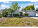Charming single-story home with attached garage and well-maintained landscaping at 7824 Blackstone Dr, Port Richey, FL 34668