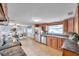 Spacious kitchen featuring stainless steel appliances and an open layout leading to the dining area at 7824 Blackstone Dr, Port Richey, FL 34668