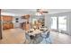 Open concept kitchen and dining room has modern appliances, backyard access and decorative furniture at 7824 Blackstone Dr, Port Richey, FL 34668
