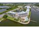 Waterfront resort-style complex featuring a pool, landscaping, and stunning water views at 8800 Bay Pines Blvd # 318, St Petersburg, FL 33709