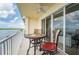 Inviting balcony with a table and chairs, showcasing serene water views at 8800 Bay Pines Blvd # 318, St Petersburg, FL 33709