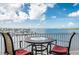Cozy balcony with seating, offering picturesque views of the serene water and marina at 8800 Bay Pines Blvd # 318, St Petersburg, FL 33709