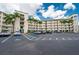 Spacious parking lot with lush tropical landscaping and easy access to building amenities at 8800 Bay Pines Blvd # 318, St Petersburg, FL 33709