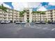 Well-maintained condo building featuring ample parking, lush landscaping, and a convenient entrance for residents at 8800 Bay Pines Blvd # 318, St Petersburg, FL 33709