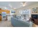 Cozy living room with a well-equipped kitchen and inviting balcony access, perfect for relaxation at 8800 Bay Pines Blvd # 318, St Petersburg, FL 33709