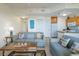 Cozy and bright living space with a partial view of the kitchen area at 8800 Bay Pines Blvd # 318, St Petersburg, FL 33709