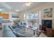 Comfortable living room with a bright kitchen and inviting balcony access for enjoying scenic views at 8800 Bay Pines Blvd # 318, St Petersburg, FL 33709