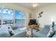 Comfortable living room with water views and access to the balcony at 8800 Bay Pines Blvd # 318, St Petersburg, FL 33709