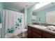 Bathroom featuring a shower with a decorative curtain, toilet, sink and vanity with granite countertops at 9736 Sage Creek Dr, Ruskin, FL 33573