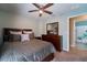 Comfortable bedroom with a ceiling fan and closet, offering a serene retreat within the home at 9736 Sage Creek Dr, Ruskin, FL 33573