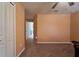 Bedroom featuring carpet floors and access to hallway at 9736 Sage Creek Dr, Ruskin, FL 33573