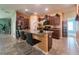 Open kitchen with stainless steel appliances, granite countertops, and island seating for casual dining at 9736 Sage Creek Dr, Ruskin, FL 33573