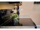 Close up of modern electric stove with granite countertops, accented with decorative greenery at 9736 Sage Creek Dr, Ruskin, FL 33573