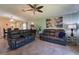 Spacious living area featuring neutral walls, tile flooring, and contemporary decor at 9736 Sage Creek Dr, Ruskin, FL 33573